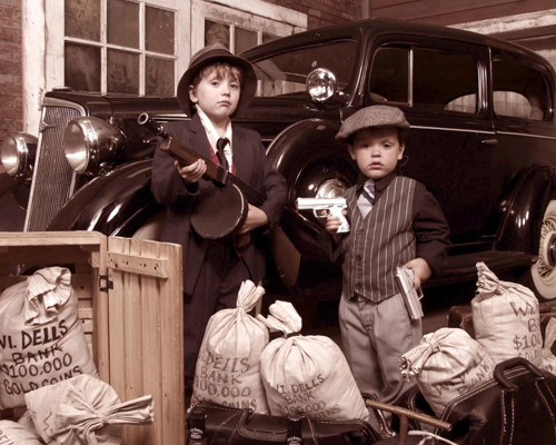 Two Young Boys Dressed Like Gangsters in Old Times