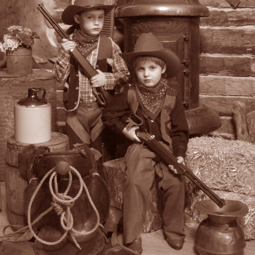 Two Young Boys in a Vintage Cabin Themed Portrait